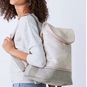 Stella & Dot Blush Camouflage Backpack with shoe compartment. Never been used.